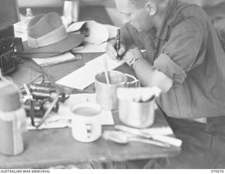 NAMBARIWA POINT, NEW GUINEA. 1944-01-25. NX131656 LIEUTENANT C.F. WATSON, EDUCATION OFFICER OF THE 8TH INFANTRY BRIGADE (1) NOW ACTING AS MILITARY LANDING OFFICER IS KEPT BUSY SUPERVISING THE ..