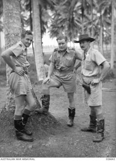 MILNE BAY, PAPUA. 1942-09. COMMANDING OFFICERS OF FAMOUS RAAF SQUADRONS AT MILNE BAY. LEFT TO RIGHT:- WING-COMMANDER J.R. BALMER, COMMANDING 1ST AUSTRALIAN BEAUFORT TORPEDO-BOMBER SQUADRON; ..