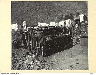 ORO BAY, NEW GUINEA. 1943-07. THE BOTTLE STACK IN THE INCINERATOR AREA OF THE 10TH FIELD AMBULANCE