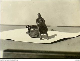 AITAPE, NORTH EAST NEW GUINEA. C. 1945-06. A NOSE PISTOL OF THE TYPE WHICH WAS FITTED BY RAAF ARMOURERS TO JAPANESE BOMBS CAPTURED ON THE AIRSTRIP AT TADJI AND USED IN ATTACKS ON JAPANESE ..