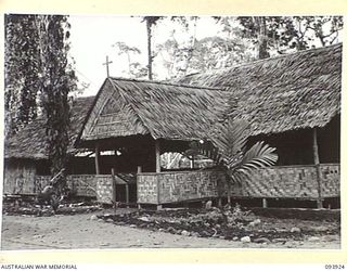 TOROKINA, BOUGAINVILLE, 1945-07-12. THE EXTERIOR OF THE NEW CHAPEL AT HEADQUARTERS 2 CORPS. IT WAS OPENED WITH A CONFIRMATION SERVICE CONDUCTED BY CHAPLAIN GENERAL C.L. RILEY, CHURCH OF ENGLAND, ..