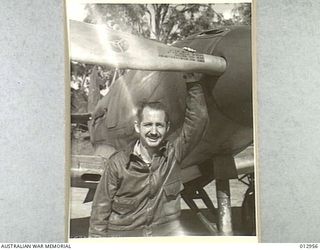 CAPT. LEWIS B. MENG OF ATLANTA, GEORGIA, LEADER OF THE SQUADRON OF AIRACOBRAS, WHO IS HIMSELF CREDITED WITH ONE ZERO CONFIRMED ONE PROBABLE, AND HAS DONE GROUND STRAFING AT LAE, WHERE THE ATTACKING ..