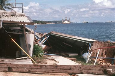 A close-up view of damage sustained by Trader Andy's Hut, a pierside bar and grill, during an earthquake that struck the region on August 8th