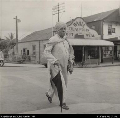 Man walking across the road