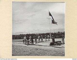 CAPE WOM, NEW GUINEA, 1945-09-13. VIEW OF PARADE OF 6 DIVISION TROOPS WHO ATTENDED THE SURRENDER CEREMONY HELD AT CAPE WOM AIRSTRIP. LIEUTENANT-GENERAL H. ADACHI, COMMANDER 18 JAPANESE ARMY IN NEW ..