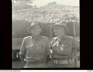 Lae, New Guinea. 1944-10-02. VX39135 Major A.K. Gough, Assistant Master-General of Ordnance (Engineering), Headquarters New Guinea Force, on the left, and NX201 Major H.E. Gale, MBE, Camp ..