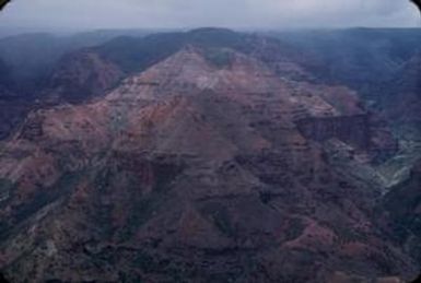 [Landscape of red, eroding gorges and valleys of Waimea Canyon, United States]