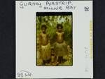 [Two girls and boy at] Gurney airstrip, Milne Bay, [Papua New Guinea, 1964?]