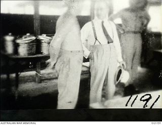 AITAPE, NORTH EAST NEW GUINEA. C. 1944-06. ARTHUR DRAKEFORD, THE MINISTER FOR AIR (CENTRE), IN THE AIRMEN'S MESS DURING THE MINISTER'S VISIT TO RAAF UNITS IN THE NEW GUINEA AREA