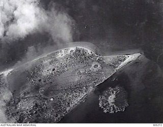 REKATA BAY, SANTA ISABEL ISLAND, BRITISH SOLOMONS ISLAND PROTECTORATE. C.1943. SPLASHES IN THE WATER NEAR THE SHORE MARK WHERE BOMBS HAVE EXPLODED DURING A RAID ON THE JAPANESE SEAPLANE BASE. NOTE ..