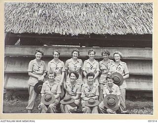LAE, NEW GUINEA. 1945-05-07. A GROUP OF AUSTRALIAN WOMEN'S ARMY SERVICE OUTSIDE A HUT AT THE AWAS BARRACKS IN BUTIBUM ROAD. THEY HAD SPENT TWO YEARS ON THE STRENGTH OF THE FIRST ARMY. IDENTIFIED ..