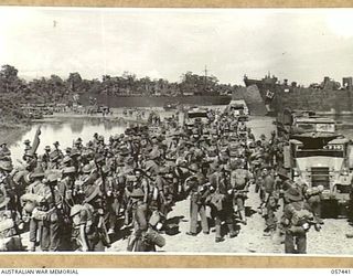 FINSCHHAFEN, NEW GUINEA, 1943-09-22. TROOPS OF THE FINSCHHAFEN FORCE ASSEMBLED ON THE BEACH PRIOR TO EMBARKATION