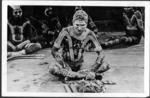 Australian Aborigines. Doli (centre) displays costume and instruments used.