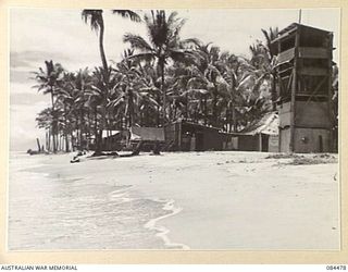 LAE, NEW GUINEA. 1944-12-18. THE FORESHORE SHOWING ADMINISTRATION OFFICES, THE RATION STORE, AND THE GENERAL STORE AT HQ 12 SMALL SHIP COY