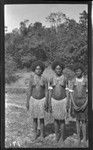 Women wearing several necklaces, including kina, a crescent shell valuable