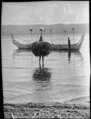 Single Dukduk walking ashore from a canoe, Rabaul Harbour, New Guinea, ca. 1929, 2 / Sarah Chinnery