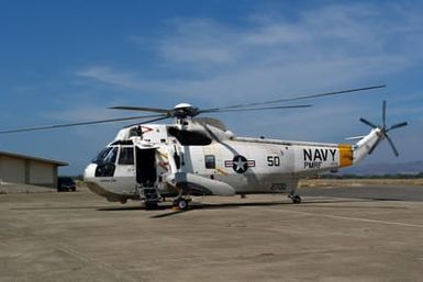 The Outrider 50, a U.S. Navy UH-3H Sea King helicopter, also known as"Kekaha Town,"lands for the final time at the Pacific Air Museum, Ford Island, Hawaii, on Aug. 28, 2006. The helicopter is one of three aircraft being decommissioned from the Pacific Missile Range Facility on Kuaui, Hawaii. It has logged more than 13,500 flight hours during its almost 40-years of service with Navy. (U.S. Navy photo by CHIEF Mass Communication SPECIALIST Joe Kane) (Released)