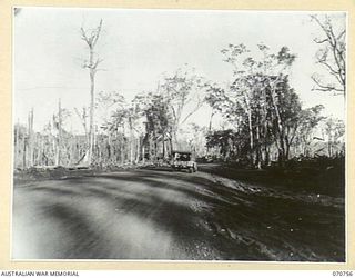 CAPE GLOUCESTER AREA, NEW BRITAIN, 1944-03-07. THE FINISHED ROAD ALONG THE COAST BETWEEN YELLOW BEACH AND CAPE GLOUCESTER, PICTURED APPROXIMATELY ONE MONTH AFTER THE LANDING AT YELLOW BEACH. IT ..