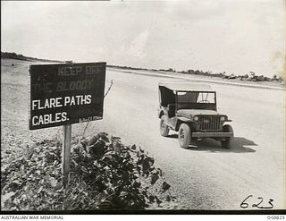 KIRIWINA, TROBRIAND ISLANDS, PAPUA. 1944-01-31. WITH NO WOMEN ABOUT, 73 WING RAAF SIGN WRITERS IN THE SOUTH-WEST PACIFIC AREA CAN LET THEMSELVES GO. THIS IS COMPARATIVELY MILD TO A FEW THAT DRAW ..