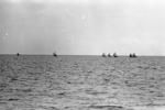 Canoe fleet on the lagoon. The outer islets can be seen in the background