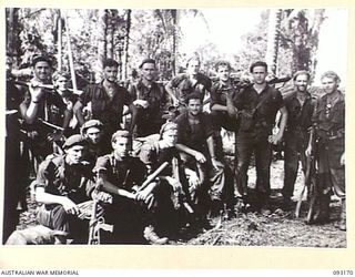 MOROKAIMORO, BOUGAINVILLE, 1945-06-12. MEMBERS OF A TROOP, 2/8 COMMANDO SQUADRON ON THEIR RETURN FROM AN EIGHT DAY PATROL TO DIO DIO ON THE COAST. THE SQUADRON, ASSISTED BY NATIVES OF THE AREA, IS ..