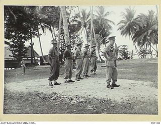 JACQUINOT BAY, NEW BRITAIN. 1945-04-21. MAJOR GENERAL H.C.H. ROBERTSON, GENERAL OFFICER COMMANDING 5 DIVISION, DELIVERING AN ANZAC DAY SPEECH TO HEADQUARTERS 5 DIVISION PERSONNEL. IDENTIFIED ..