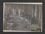 Women weaving on verandah, Colonel JK Murray looking on with others, Kwato Mission?, Papua New Guinea, c1948