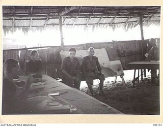 CAPE WOM, NEW GUINEA, 1945-12-01. CORPORAL YAMAMOTO GIVING EVIDENCE AT THE TRIAL OF LIEUTENANT TAZAKI, WHO WAS CHARGED WITH AND LATER SENTENCED TO DEATH FOR CANNIBALISM, MUTILATING AND EATING THE ..