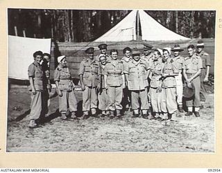 BOUGAINVILLE. 1945-06-09. GENERAL SIR THOMAS A. BLAMEY. COMMANDER-IN-CHIEF, ALLIED LAND FORCES, SOUTH WEST PACIFIC AREA (1) AND MEMBERS OF THE STAFF OF 109 CASUALTY CLEARING STATION AT MOTUPENA ..