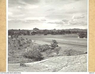 12 MILE, LALOKI RIVER, NEW GUINEA. 1943-11-15. VIEW OF THE NO. 3 GARDEN OF THE 3RD AUSTRALIAN FARM COMPANY, AUSTRALIAN ARMY SERVICE CORPS TAKEN FROM THE ADMINISTRATIVE BUILDING