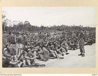 WEWAK, NEW GUINEA. 1945-10-26. A CEREMONIAL PARADE AND MARCH PAST BY 6 DIVISION WAS INSPECTED BY GENERAL SIR THOMAS A. BLAMEY, COMMANDER-IN-CHIEF, ALLIED LAND FORCES, SOUTH WEST PACIFIC AREA, AT ..