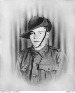Studio portrait of  Private Vasil (Basil) Albert 'Babe' Lucas who enlisted on 20 June 1940, aged 15, with the service number NX33033. Pte Lucas had put his age up to enllist. He was discharged on ..
