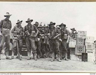 PORT MORESBY, PAPUA, NEW GUINEA. 1944-01-05. TROOPS OF THE 58/59TH AUSTRALIAN INFANTRY BATTALION, 15TH AUSTRALIAN INFANTRY BRIGADE, WITH THEIR STORES, READY TO EMBUSS FOR THEIR TRIP TO THE AIRSTRIP ..