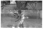 Child carrying plants