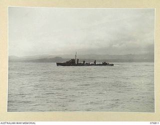 WIDE BAY, NEW BRITAIN. 1944-11-04. THE RAN DESTROYER HMAS VENDETTA STANDING BY DURING THE NAVAL BOMBARDMENT OF THE JAPANESE POSITIONS ALONG THE COAST