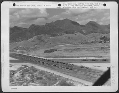 Aerial View Of Inspection Of Republic P-47 'Thunderbolts' Of The 318Th Fighter Group, Prior To Move To Saipan, Marianas Islands. 15 May 1944. Bellows Field, Oahu, Hawaii. (U.S. Air Force Number A63568AC)