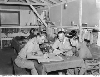 TOROKINA, BOUGAINVILLE ISLAND, SOLOMON ISLANDS. 1945-07-23. ARMY LIAISON OFFICERS BRIEFING PILOTS OF NO. 5 (TACTICAL RECONNAISSANCE) SQUADRON RAAF BEFORE THEY SET OUT ON A PHOTOGRAPHIC MISSION OVER ..