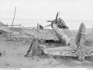 BUT AREA, DAGUA, NORTH EAST NEW GUINEA. C. 1945-05. THIS MITSUBISHI KI-51, ARMY TYPE 99 ASSAULT PLANE, JAPANESE RECONNAISSANCE AND LIGHT DIVE-BOMBER AIRCRAFT, ALLIED CODE NAME SONIA, WAS INTACT AND ..