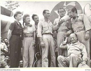 1944-09-15. NEW GUINEA: BOB HOPE AND PARTY RECEIVE A TUMULTUOUS WELCOME FROM LIBERATOR FORMATION BASED IN DUTCH NEW GUINEA. HOPE CHRISTENED THE MACHINE WHICH WAS NAMED IN HIS HONOR. THE PERSONNEL ..