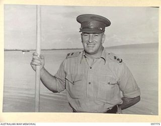 TOBOI WHARF, RABAUL, NEW BRITAIN. 1945-10-05. LIEUTENANT COLONEL C. NORMOYLE, COMMANDING OFFICER OF THE ROYAL PAPUAN CONSTABULARY WHO TRAVELLED ON THE LAURABADA WITH MAJOR GENERAL B.M. MORRIS, ..