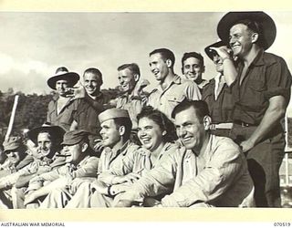 PORT MORESBY, PAPUA, 1944-02. AUSTRALIAN AND AMERICAN PERSONNEL VIEWING A SOFTBALL GAME AT A UNITED STATES HOSPITAL IN THE AREA. SOFTBALL IS POPULAR WITH BOTH AMERICANS AND AUSTRALIANS AND ..