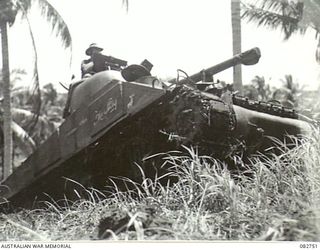 'The Stag', a Sherman M4A2 medium tank, approaching the top of Course no. 2 during tank tests at HQ 4 Armoured Brigade