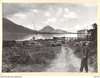 RABAUL, NEW BRITAIN, 1945-09-10. JAPANESE STAFF CARS IN THE PARKING AREA. TROOPS OF 4 INFANTRY BRIGADE OCCUPIED THE RABAUL AREA FOLLOWING THE SURRENDER OF THE JAPANESE