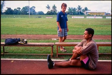 Young male athlete stretching,Tonga