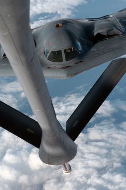 A U.S. Air Force B-2 Spirit bomber aircraft from the 509th Bomber Wing, Whiteman Air Force Base, Mo., is refueled by a KC-135 tanker aircraft from the 126th Air Refueling Wing, Illinois Air National Guard, over the Pacific Ocean on April 4, 2005. The 509th BW is currently deployed at Andersen Air Force Base, Guam. (U.S. Air Force PHOTO by MASTER SGT. Val Gempis) (Released)