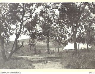 FOUR MILE VALLEY, NEW GUINEA, 1944-02-03. THE VALLEY VIEWED FROM HEADQUARTERS, NEW GUINEA FORCE. THE CHURCH OF ENGLAND TENT STANDS TO THE RIGHT OF THE PICTURE