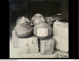PORT MORESBY, PAPUA. 1944-08-30. COCONUTS ADDRESSED TO FOR THE FOLK AT HOME FORM PORTION OF THE PARCEL MAIL FROM THE MORESBY RAAF POST OFFICE