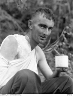 DANMAP RIVER AREA, NEW GUINEA. 1945-01-02. PRIVATE FERGUSON, 2/11TH INFANTRY BATTALION, WHO WAS WOUNDED DURING THE ATTACK ON JAPANESE POSITIONS ON A HILL FEATURE BEYOND MATAPAU