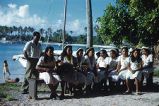 Native women sitting in a group playing guitars, Likiep Atoll, August 20, 1949