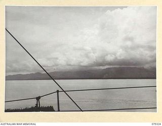 BUT AREA, NEW GUINEA. 1945-02-26. A SECTION OF THE COASTLINE IN THE BUT- KUAK AREA BETWEEN AITAPE AND WEWAK DURING A BOMBARDMENT OF THE JAPANESE POSITIONS BY THE RAN VESSEL HMAS SWAN